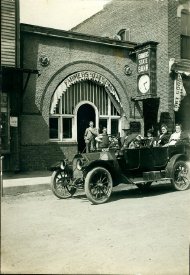 Model T Ford at Farmers State Bank, Ira Richardson driver, circa 1915
