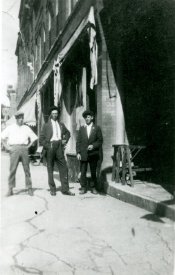 Men on Main St. at Elsen House, Matt Elsen in center