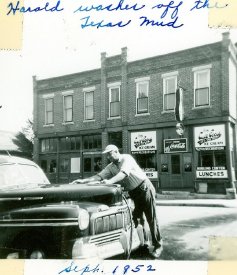 Harold Doschadis washing his car, fall of 1952.