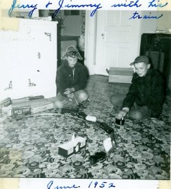Jerry and Jimmy playing with electric train, 1952