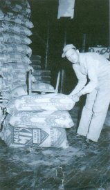 Sandy Downer with feed bags at Curran Elevator